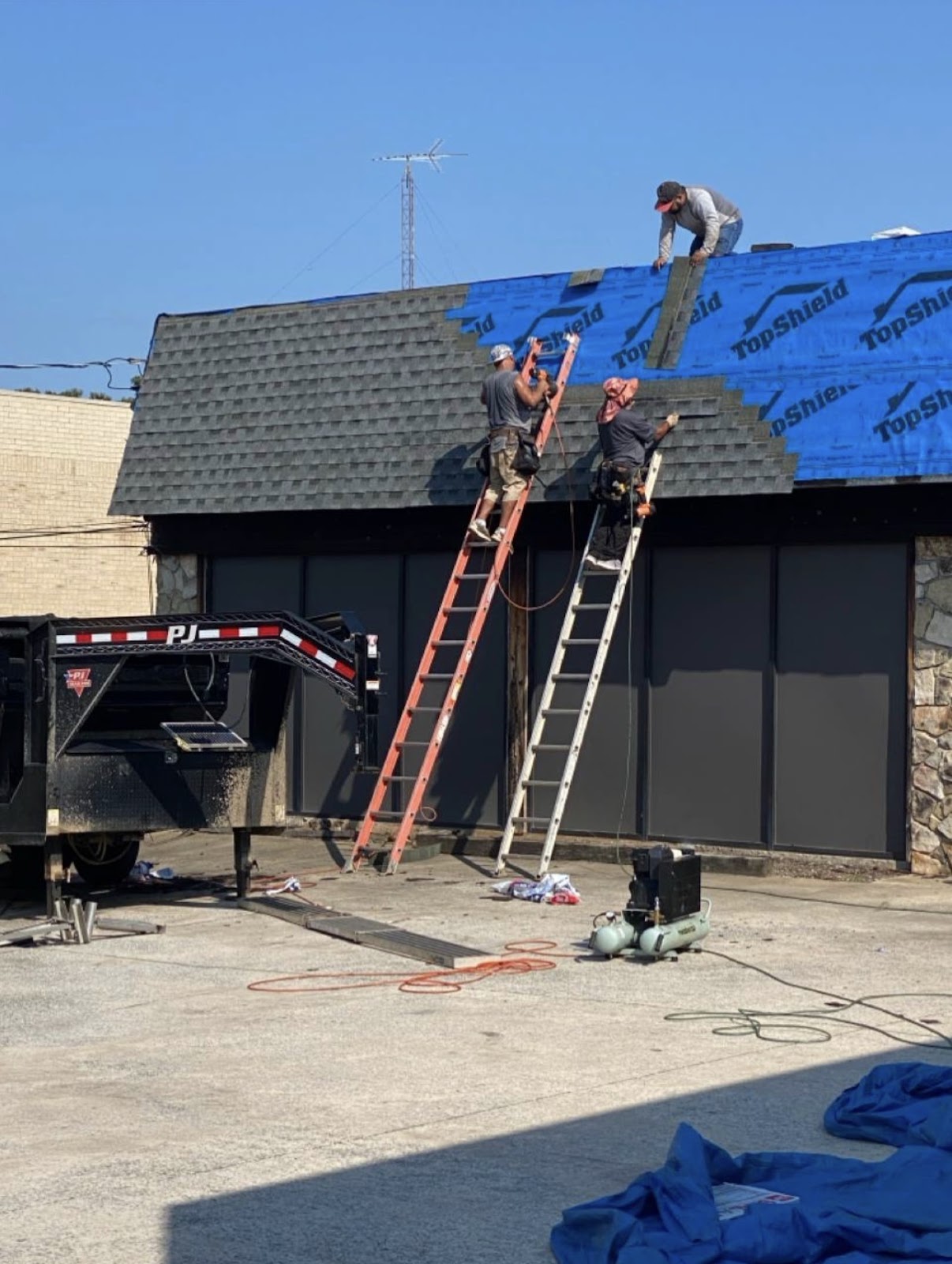 Commercial shingle replacement in progress, 2026